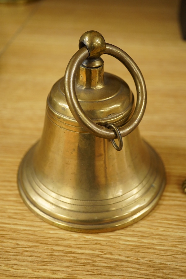 A brass bell with wall mount, 24cm high. Condition - good